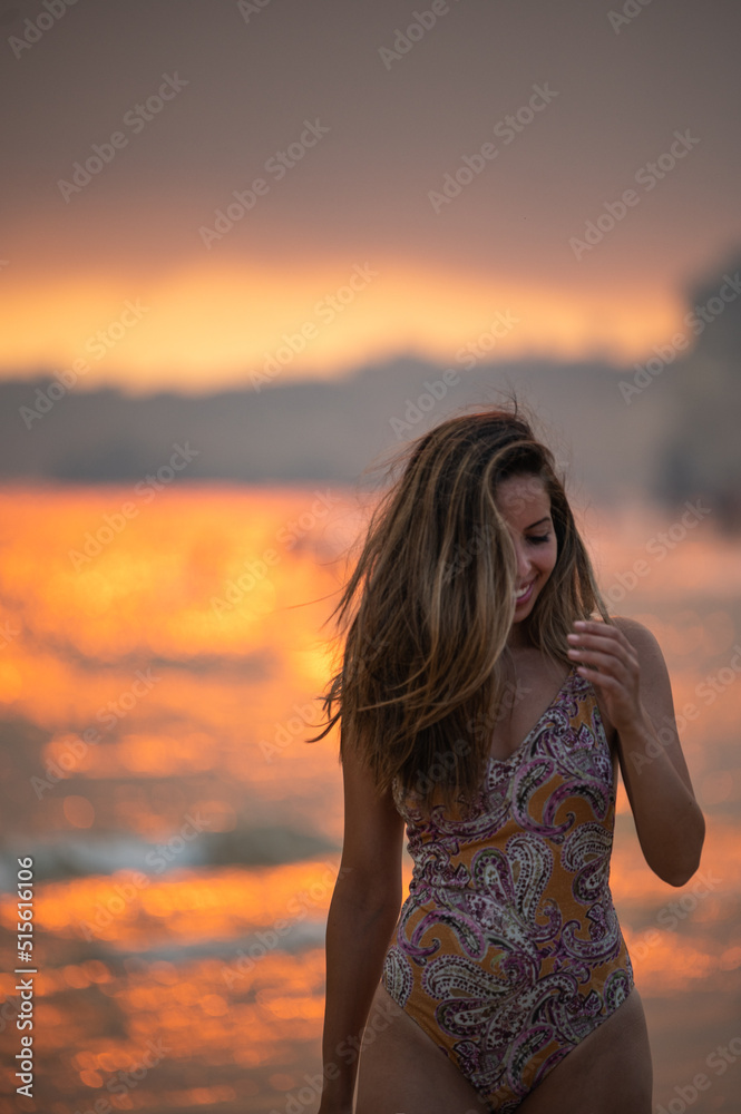 Happy woman walking on seashore