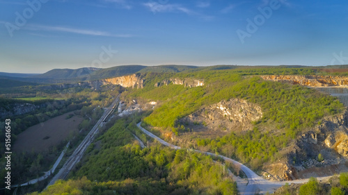 Aerial photography from a drone. View of a mining quarry aerial view at sunset
