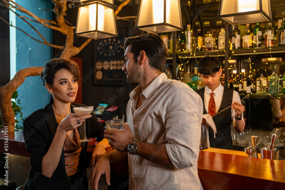 Caucasian man and woman flirting each other while hangout nightlife party at restaurant bar. Attractive female have romantic dating with boyfriend celebrating holiday event together at nightclub Caucasian man and woman flirting each other while hangout nightlife party at restaurant bar. Attractive female have romantic dating with boyfriend celebrating holiday event together at nightclub