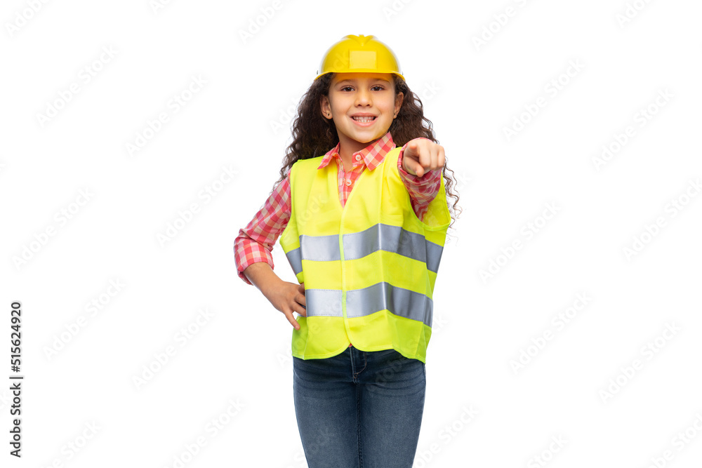 building, construction and profession concept - smiling little girl in protective helmet and safety vest pointing finger to camera over white background building, construction and profession concept - smiling little girl in protective helmet and safety vest pointing finger to camera over white background