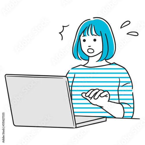 パソコン作業中に驚く女性