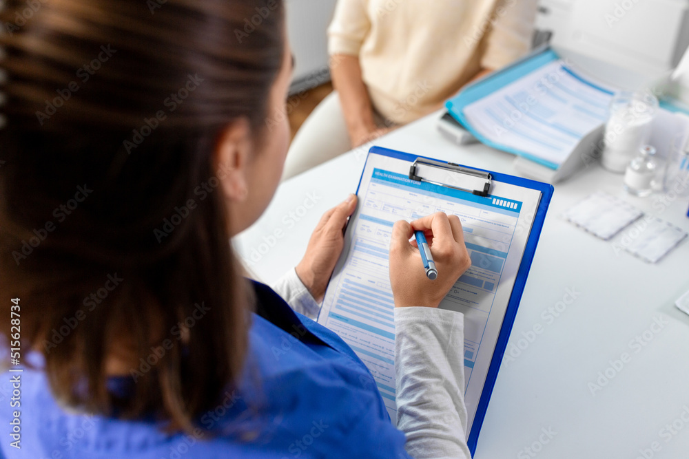 Fototapeta premium medicine, health and vaccination concept - close up of doctor with clipboard and senior woman at hospital
