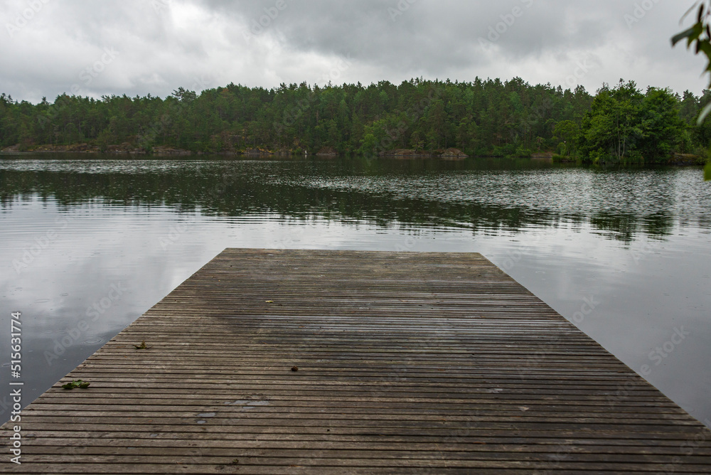 Naklejka premium wooden pier on lake