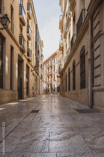 Fototapeta Naklejka Na Ścianę i Meble -  View of a narrow street in the center of Valencia