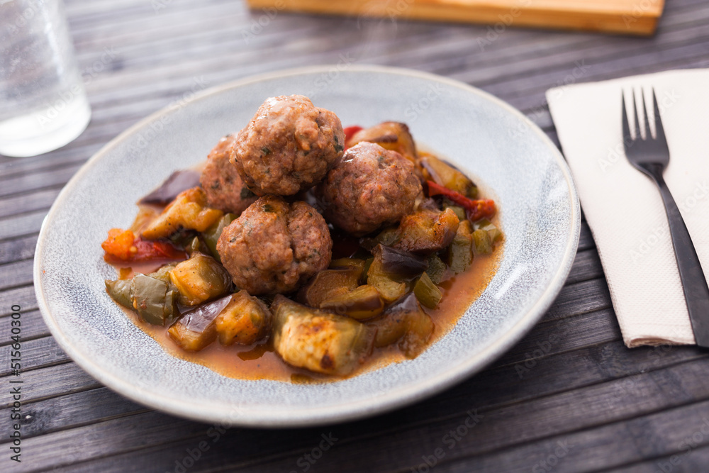 cooked meatballs with stewed eggplant with haze in bowl cooked meatballs with stewed eggplant with haze in bowl