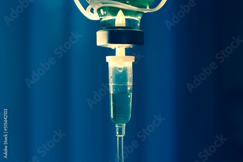 Set iv fluid intravenous drop saline drip hospital room,Medical Concept,treatment emergency and injection drug infusion care chemotherapy, concept.blue light background