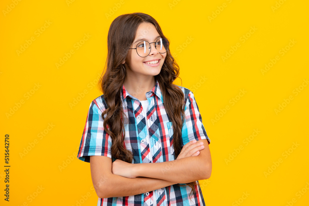 Portrait of teenager girl crossed arms isolated on yellow color background. Children lifestyle childhood concept. Portrait of teenager girl crossed arms isolated on yellow color background. Children lifestyle childhood concept.