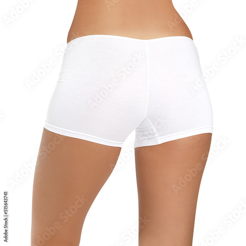 Feeling beautiful. Attractive young woman in underwear smiling while standing against white background.posing in lingerie on a white background ,back view