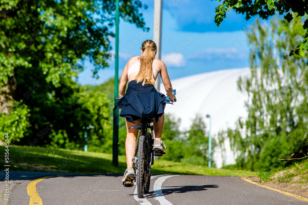 Fototapeta premium Cyclist ride on the bike path in the city Park