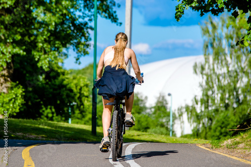 Cyclist ride on the bike path in the city Park 