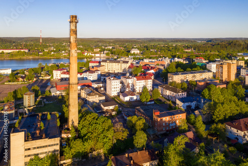 Aerial view of Sortavala town and boiler house chimney on sunny summer morning. Karelia, Russia.