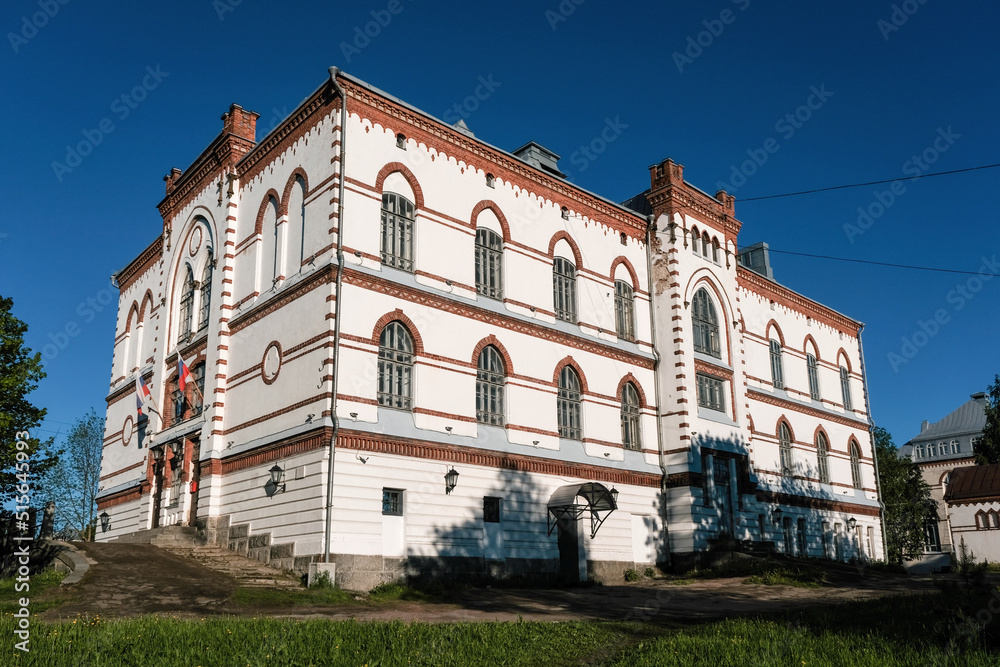 Obraz premium View of former lyceum (school, 1901) building - monument of architecture and history on sunny day. Sortavala, Karelia, Russia.