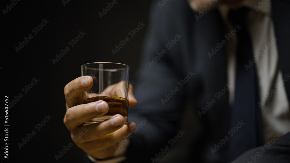 Male expert enjoying taste and aroma of strong alcoholic beverage, degustation Male expert enjoying taste and aroma of strong alcoholic beverage, degustation