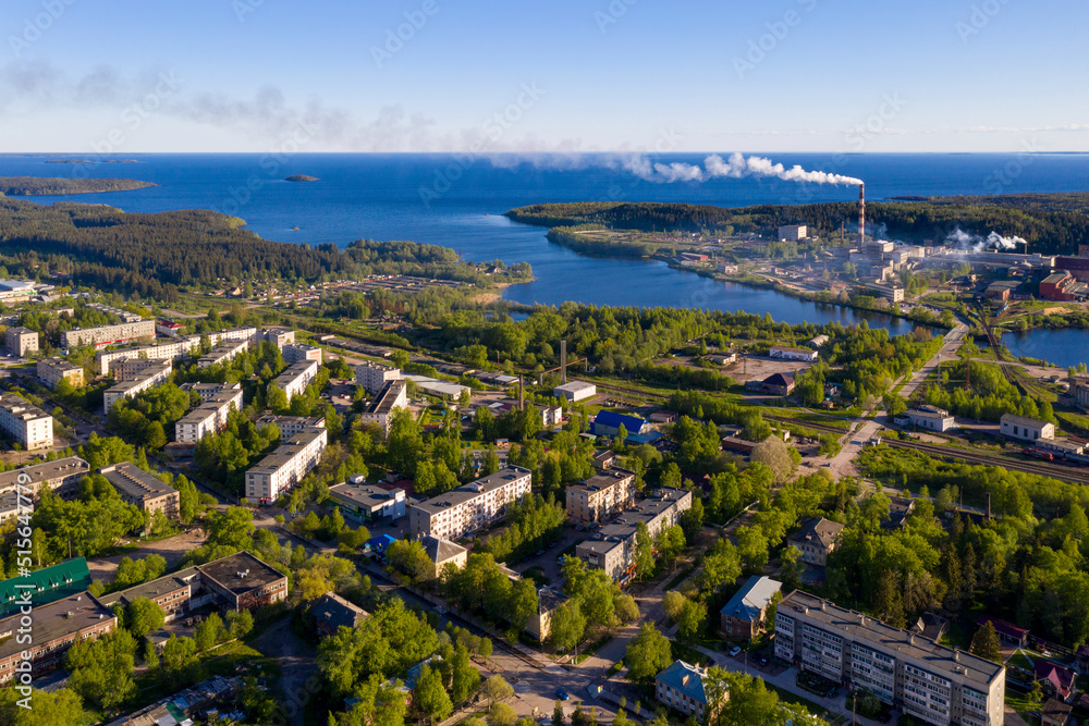 Aerial view of Pitkyaranta town and cellulose factory on sunny summer day. Karelia, Russia.