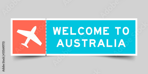 Orange and blue color ticket with plane icon and word welcome to australia on gray background