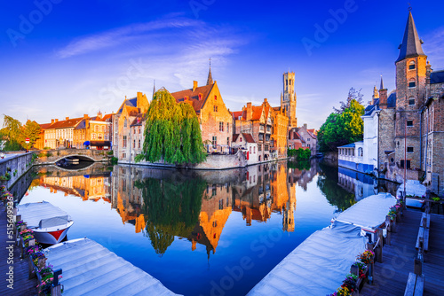 Bruges, Belgium. Sunrise on Rozenhoedkaai, old town with Belfry reflection
