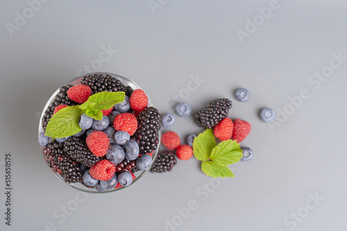 berries in a bowl on a gray background. High quality photo