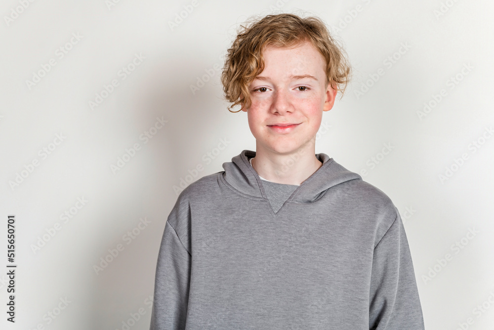 redheaded teen boy with grey shirt on studio redheaded teen boy with grey shirt on studio