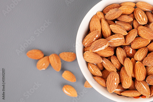 Almonds in a bowl are on the table. High quality photo