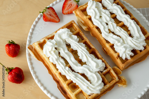Obraz na płótnie Homemade waffles with whipped cream and strawberries w salonie