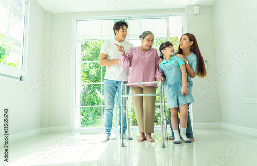 Grandma takes Walker to move into her new home with her family, her son and daughter-in-law and granddaughter are all happy to buy a new home. Home loan and family relationship concept. 