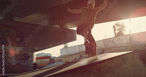 Young skater performing trick on skate board skate skate. Hipster skateboarding
