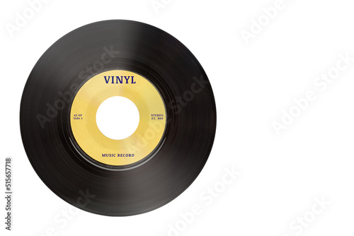 Closeup view of real gramophone vinyl record or phonograph music record with yellow label. Black musical single play disc 7 inch 45 rpm spiral groove. Stereo sound record. Isolated on white background