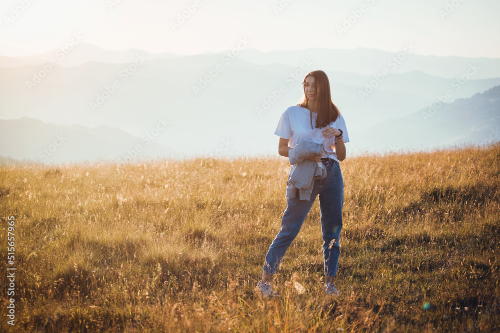 Cute Teen Girl in Golden Mountain Sunrise Landscape 