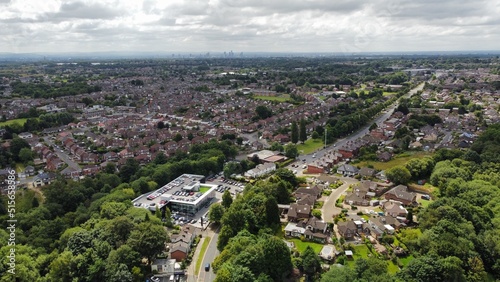 Tableau sur toile Aerial view looking down onto buildings and roads with views towards Manchester City centre in the background