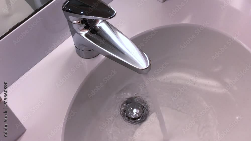 Bathroom Faucet with Flowing Water in Switzerland. Bathroom Faucet with Flowing Water in Switzerland.