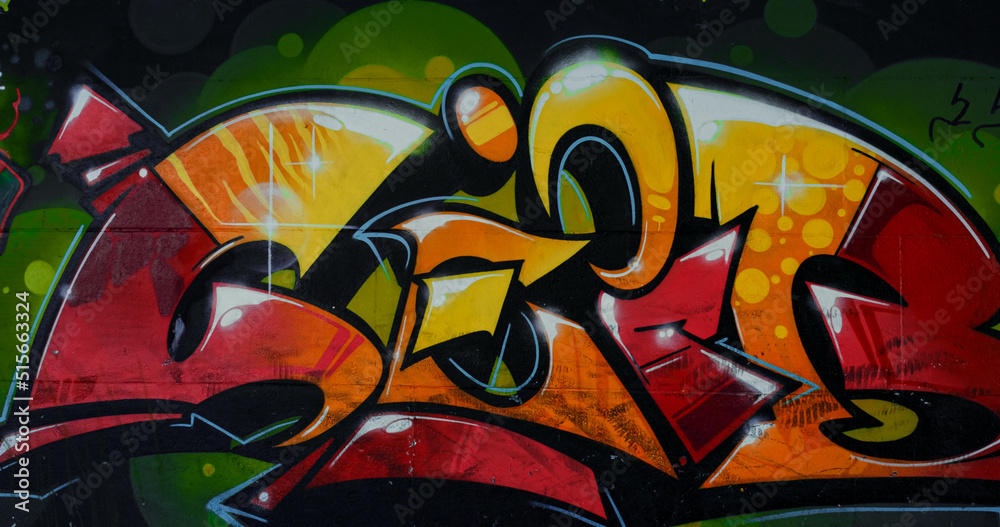 Wall painting with bright colorful graffiti at skate park. Beautiful graffiti. 