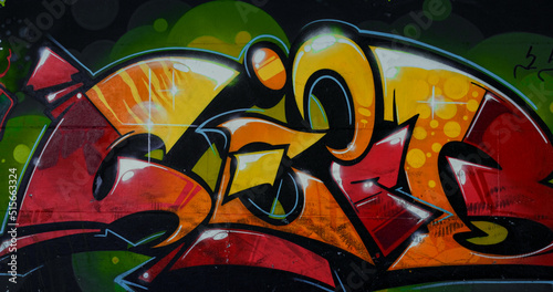 Wall painting with bright colorful graffiti at skate park. Beautiful graffiti. 