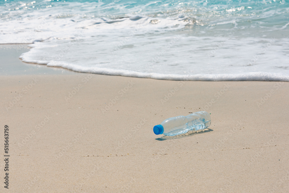 plastic trash on the beach, bottle on the beach. plastic trash on the beach, bottle on the beach.