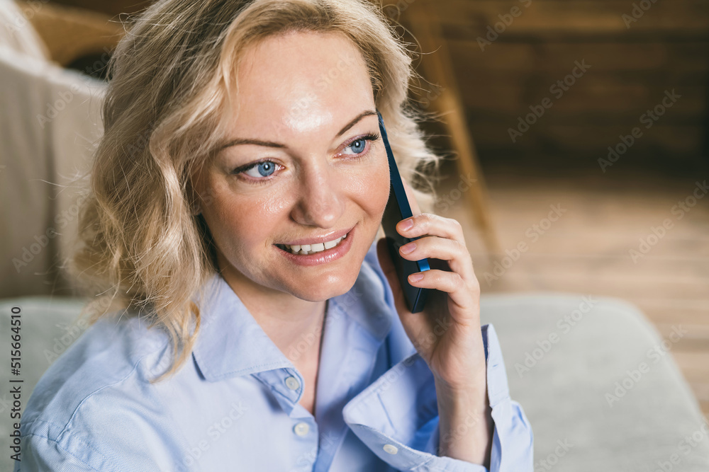 Close-up portrait of a blue-eyed woman. Modern wireless communications Close-up portrait of a blue-eyed woman. Modern wireless communications