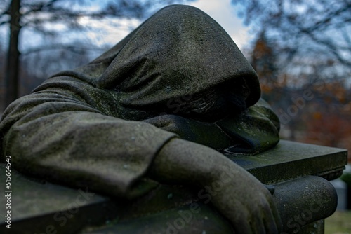 Statue of the mourning woman on the grave in Lake View Cemetery, Cleveland. Ohio, USA. photo