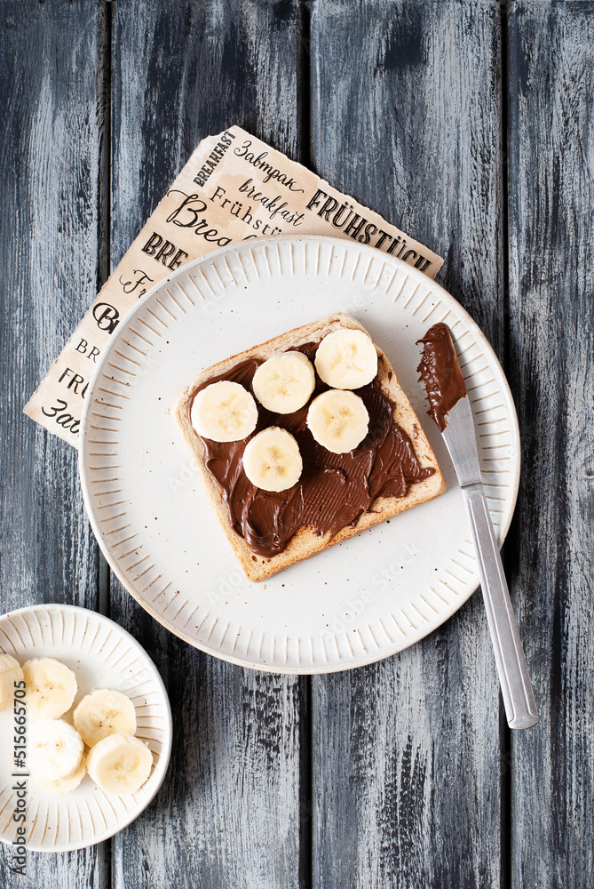 Breakfast toast with nut nougat cream, bananas and berries Breakfast toast with nut nougat cream, bananas and berries