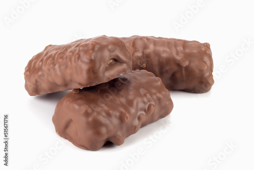 Chocolate bars with peanuts and caramel. Close up view.