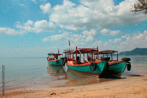 Khmer fishing boats moored at the shore of Koh Tonsay Island or Rabbit Island, popular summer destination in Cambodia