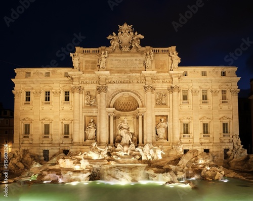 An old historical Trevi fountain in Rome, Italy at night