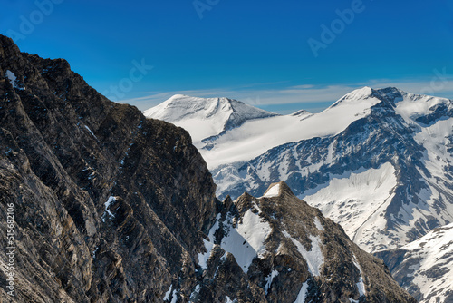 view from Kitzsteinhorn in Kaprun over snowcoverd summits of the Austrian Alps photo