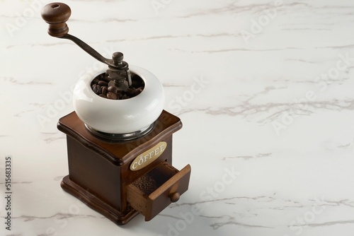 Slika na platnu Classic coffee grinder with an open powder reservoir