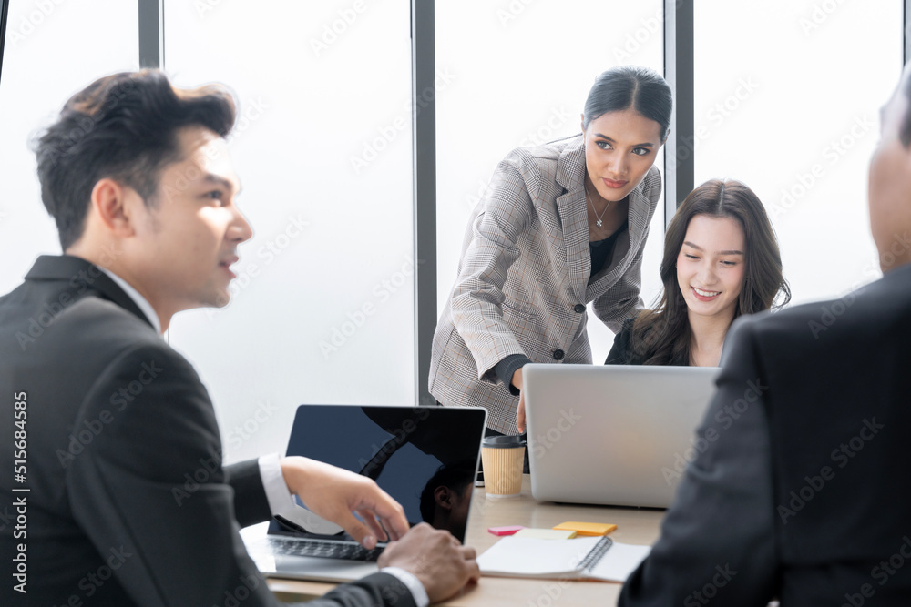 A group of young Asian businessmen Talking and planning work happily and have fun. at the company's office A group of young Asian businessmen Talking and planning work happily and have fun. at the company's office