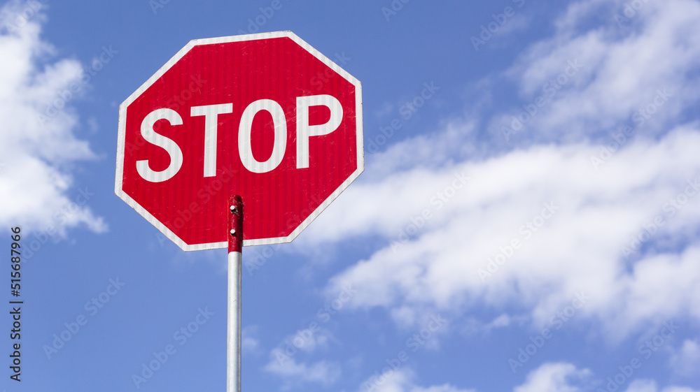 Stop sign and blue sky with copy space
