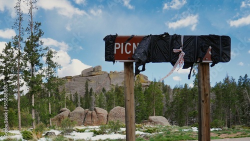View of street sign covered with a bag in background of rocky outcrops in Vedauwoo photo