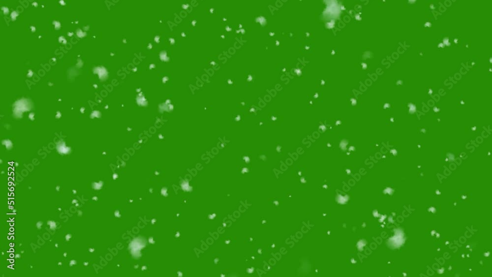 Isolated falling snow on green screen background
