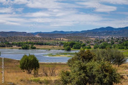 Prescott Arizona lake in the distance with desert trees in the foreground