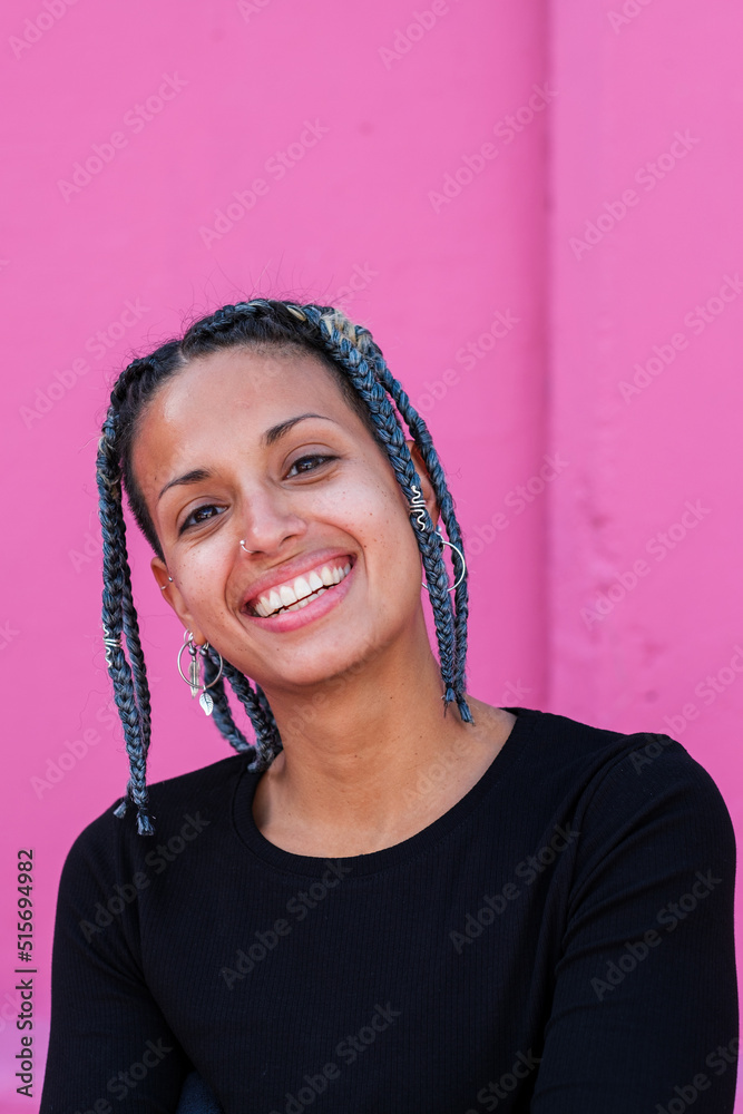 Portrait of young woman with braids and urban style outdoors Portrait of young woman with braids and urban style outdoors