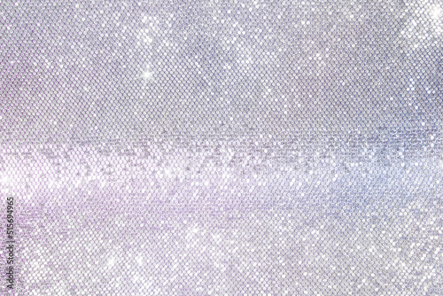 mother-of-pearl background of silver sequins, iridescent silver background photo