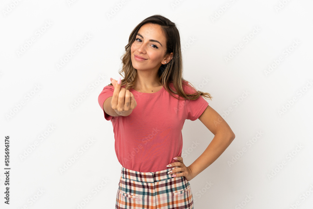 Young woman over isolated background making money gesture Young woman over isolated background making money gesture