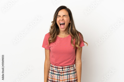 Young woman over isolated background shouting to the front with mouth wide open